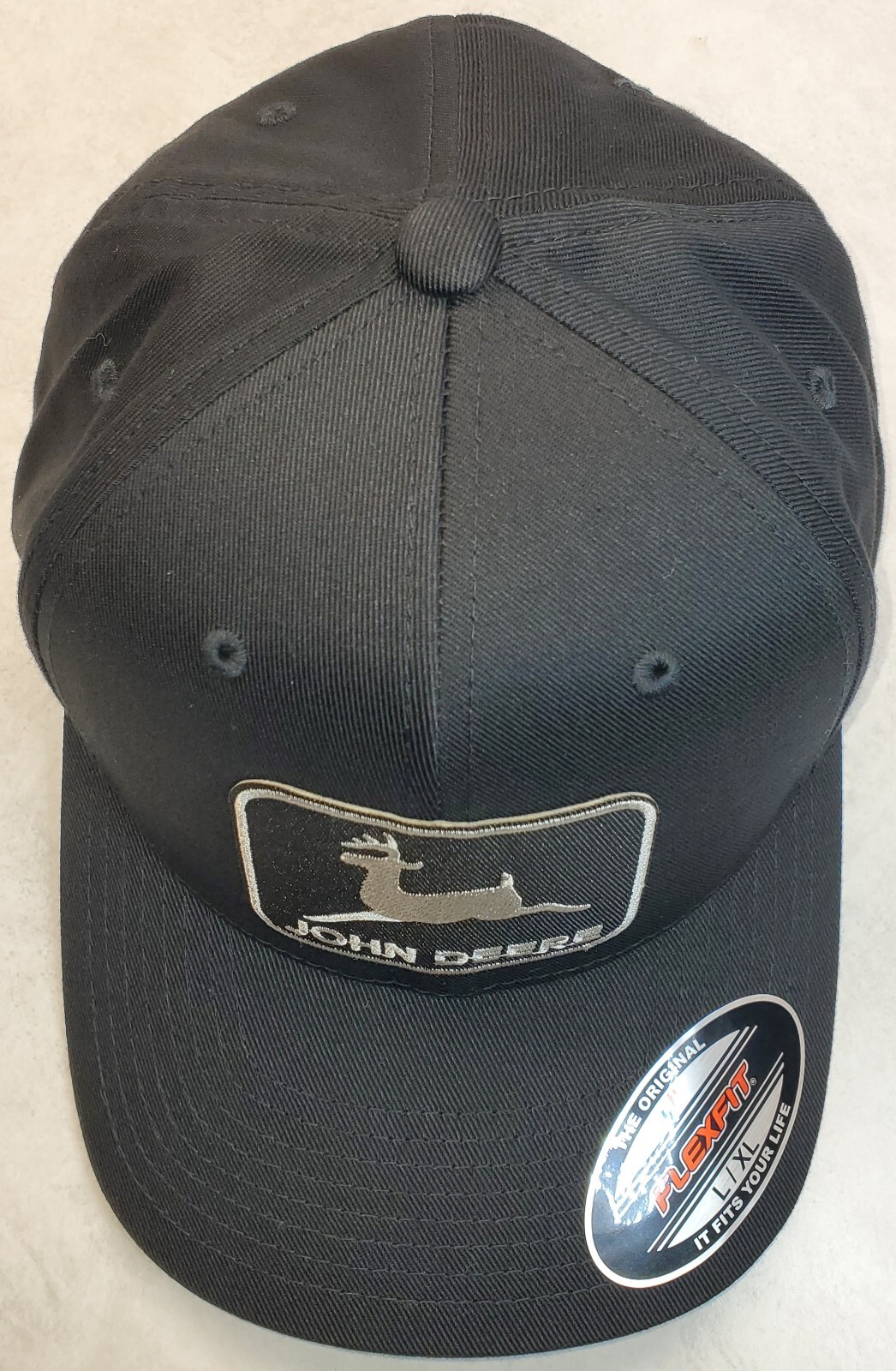 John Deere Black Patch on Flexfit Style 6277 Hat / Black – L/XL 7 1/8″ – 7 5/8″
