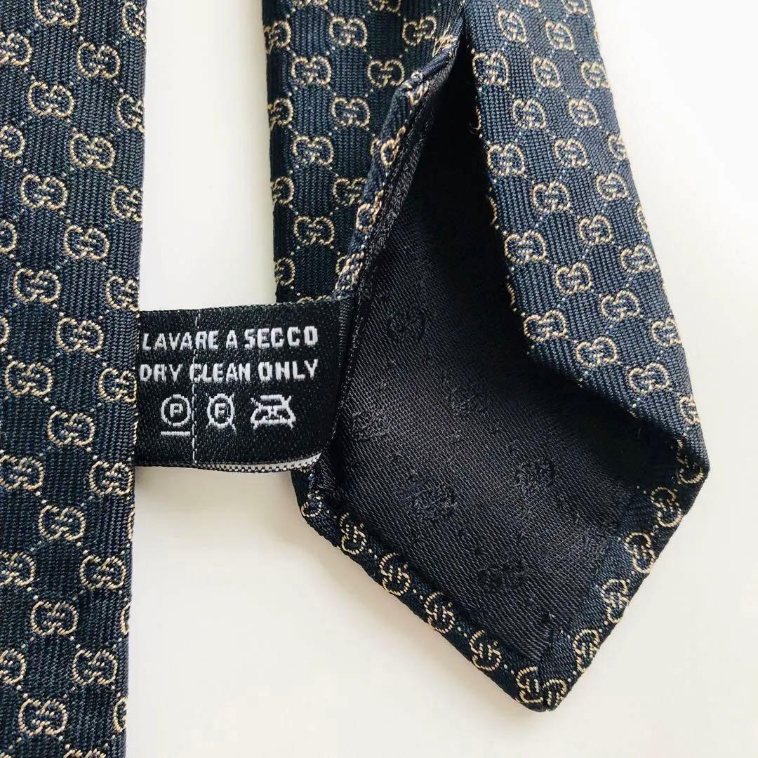 GUCCI Emblem Pattern Silk Tie Black Bronze 8.3cm Wide 154cm Long Pre-owned