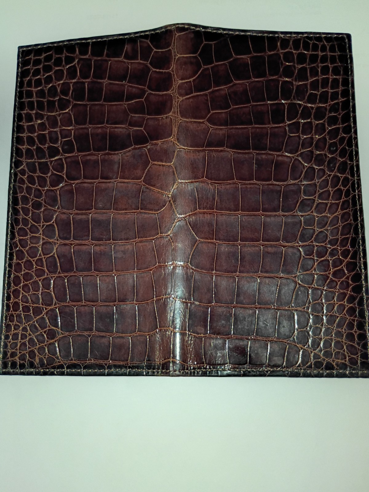 Elevate your collection with this brown glazed authentic alligator long wallet