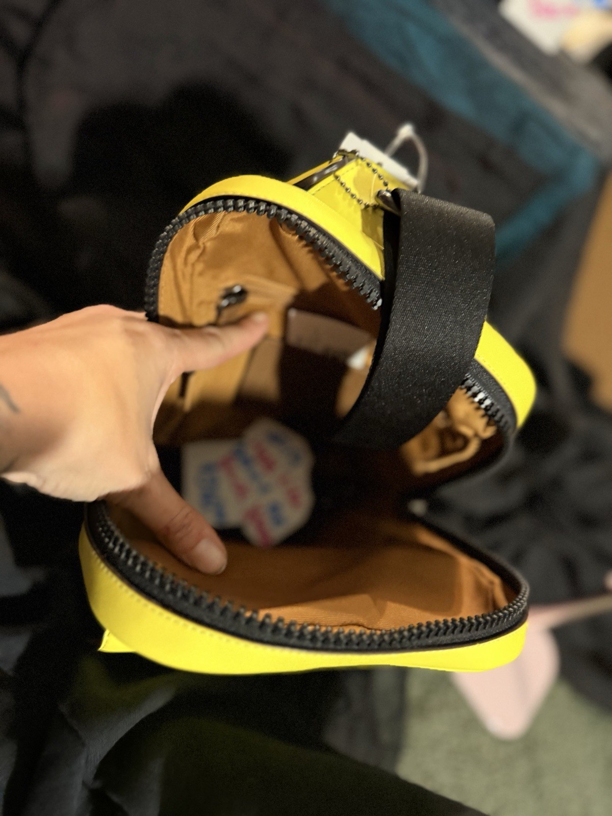 Coach Signature Medium Crossbody Zip Bag Brown Neon Black. Hangs on your back.