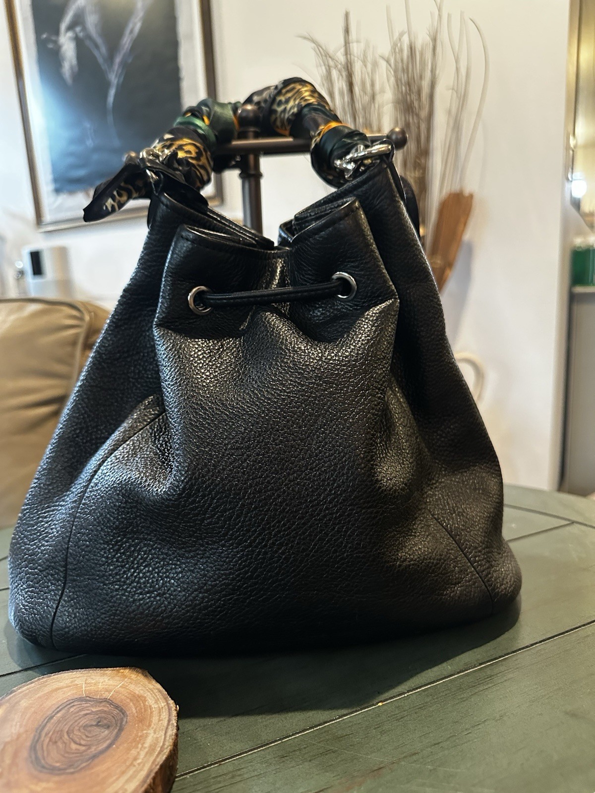 Coach Avery bucket bag. Drawstring closure and silver-tone hardware.