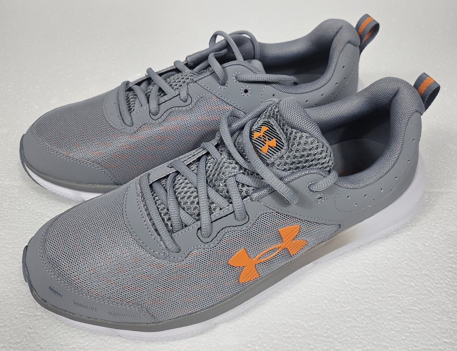 Men’s Running Shoes 11.5 Under Armour Charged Assert 10 Gray Orange 3026175-105