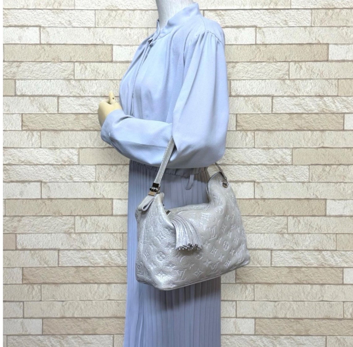 LOUIS VUITTON Shimmer Halo Silver Monogram Embossed Leather Hand Bag