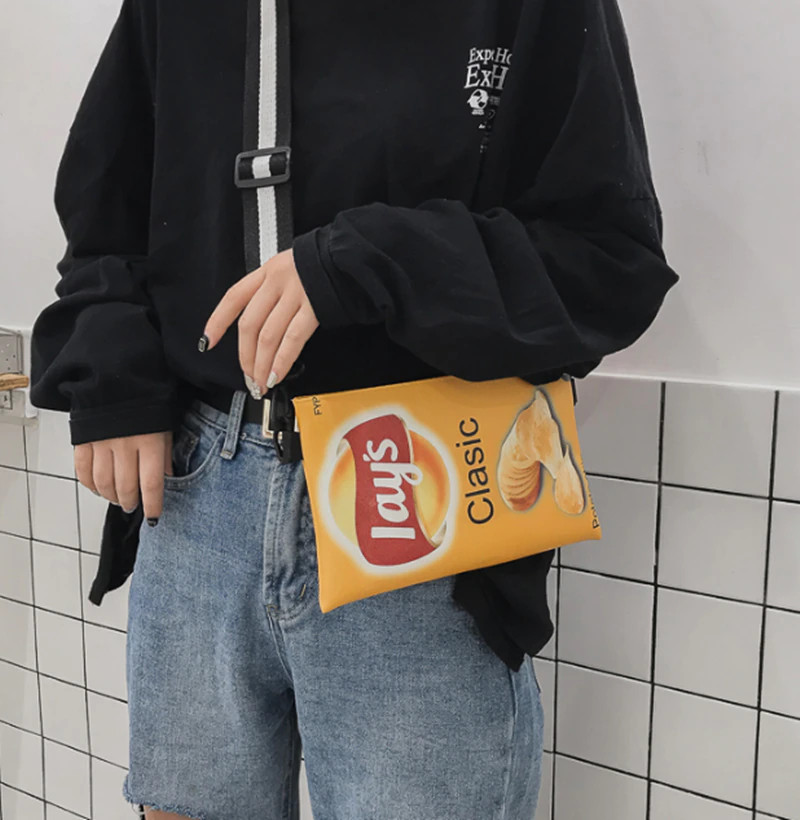 Elevate your style with this delightful Funny Potato Chips Crossbody Handbag! Cr