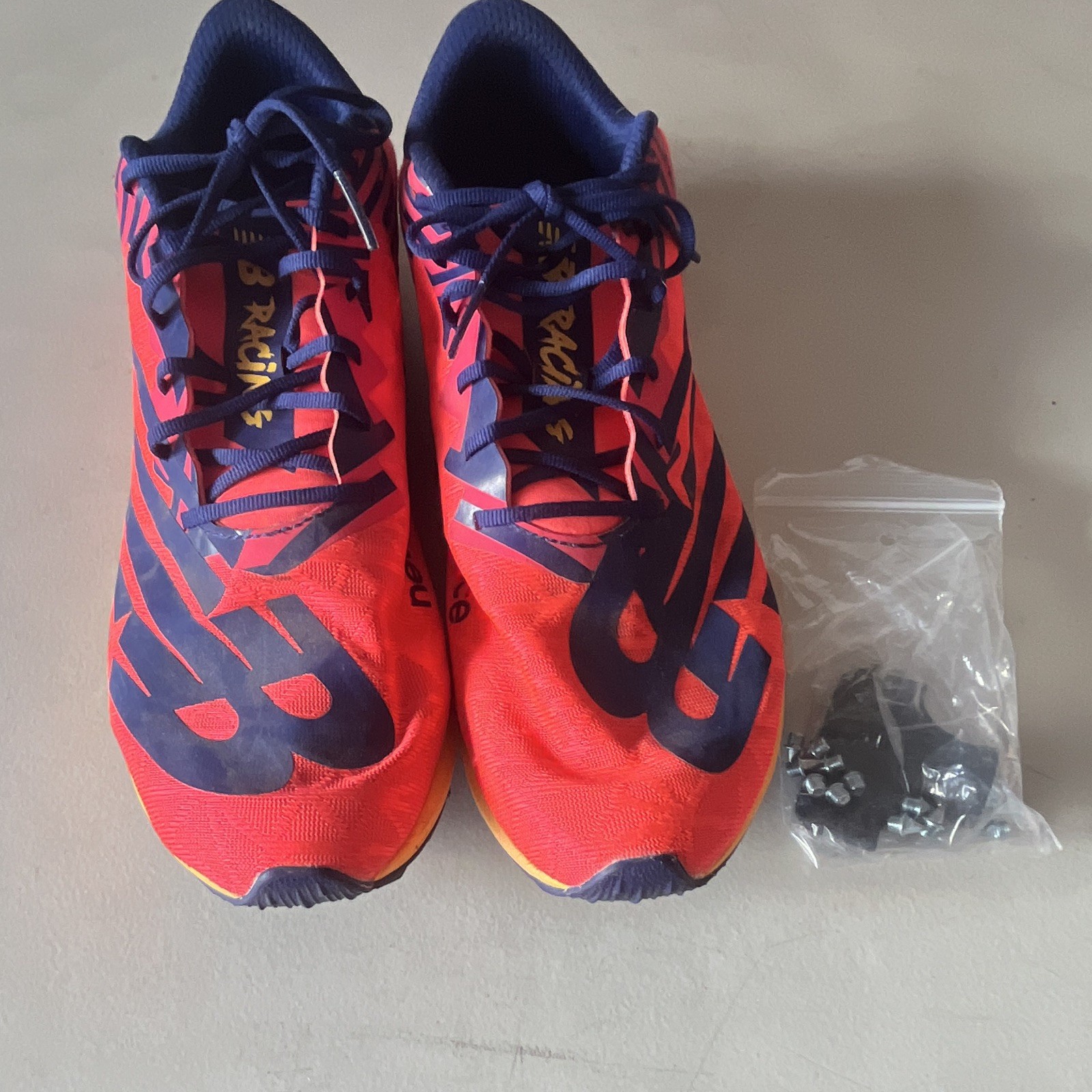 New Balance Men’s Red/Blue Low Top Lace-Up Athletic Sneaker Metal Cleats