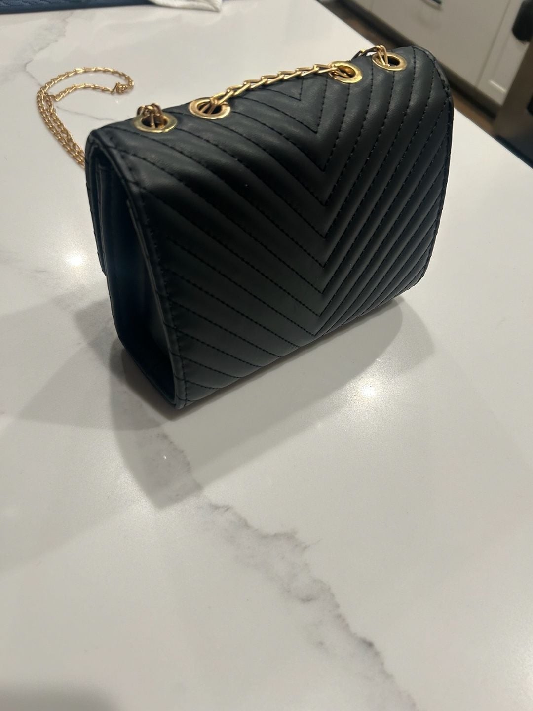 V-Logo Quilted Black Crossbody Bag with Gold Chain and Tassel