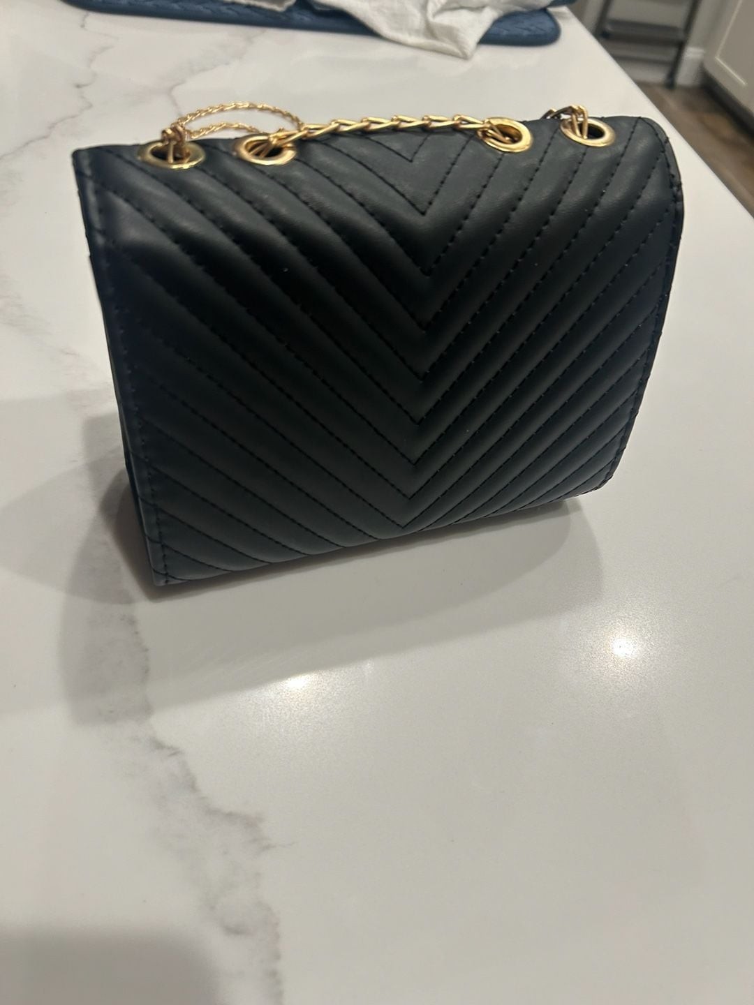 V-Logo Quilted Black Crossbody Bag with Gold Chain and Tassel